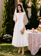 Robe midi Andrea brodée d'un nœud